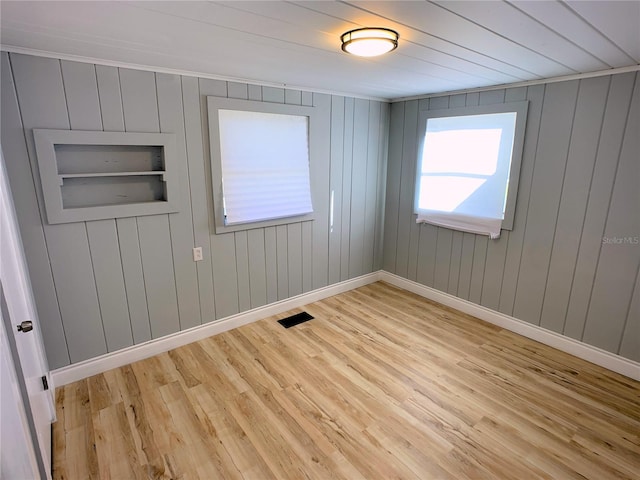 spare room featuring light wood-type flooring