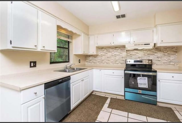 kitchen featuring white cabinets, tile patterned flooring, sink, and appliances with stainless steel finishes