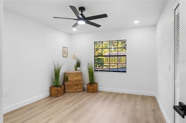 interior space with light wood-type flooring and ceiling fan