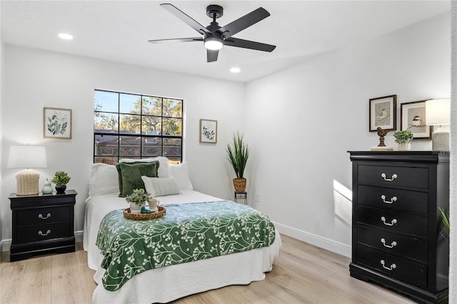 bedroom featuring ceiling fan and light wood-type flooring