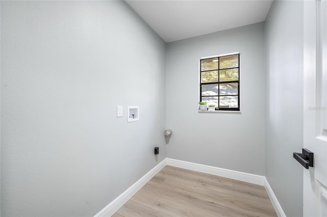 laundry room featuring light hardwood / wood-style floors and washer hookup