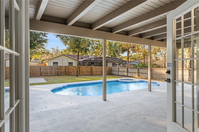 view of pool with a patio and an in ground hot tub