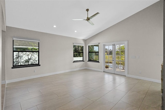 spare room featuring high vaulted ceiling and ceiling fan