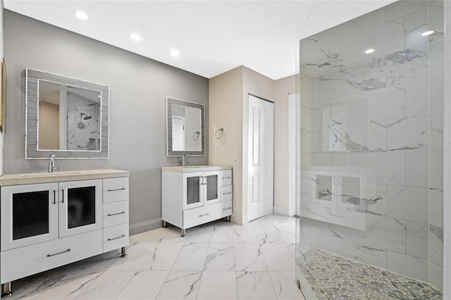 bathroom featuring vanity and a tile shower