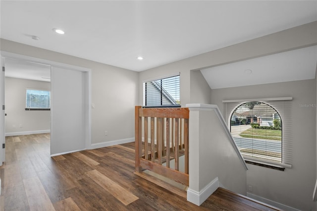 corridor with hardwood / wood-style floors