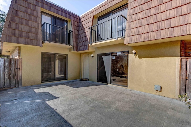 rear view of house with a balcony