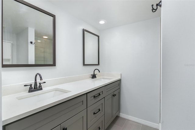 bathroom with tile patterned flooring and vanity