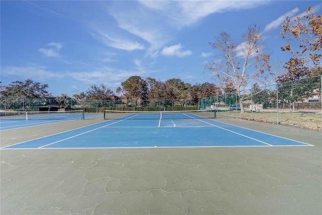 view of sport court with basketball hoop