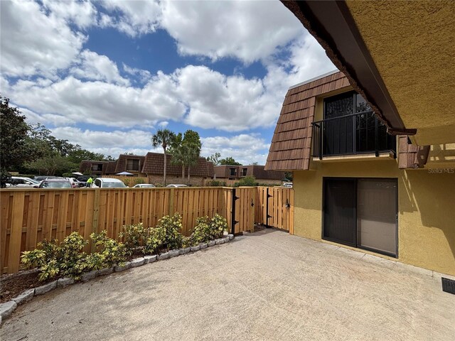 5341 Bamboo Ct Unit 418, Orlando, FL 32811 - view of patio / terrace featuring fence and a gate