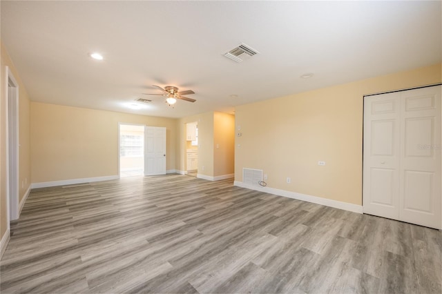 interior space with ceiling fan and light hardwood / wood-style flooring