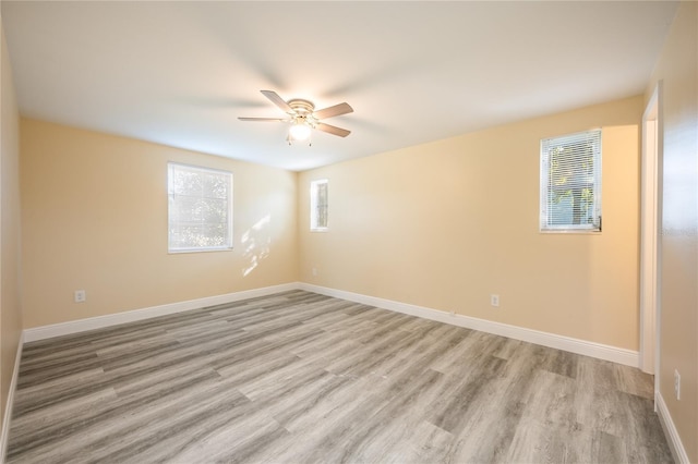 spare room with ceiling fan and light hardwood / wood-style floors