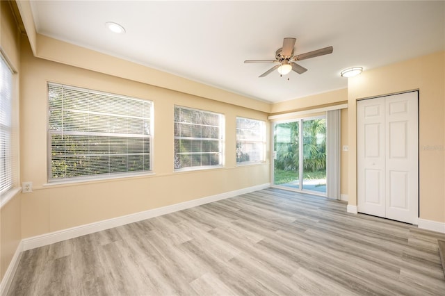 unfurnished room featuring ceiling fan and light hardwood / wood-style floors