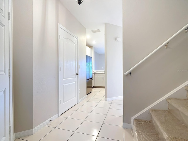 corridor with light tile patterned floors