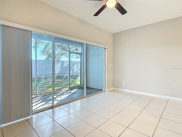 empty room with light tile patterned floors and ceiling fan