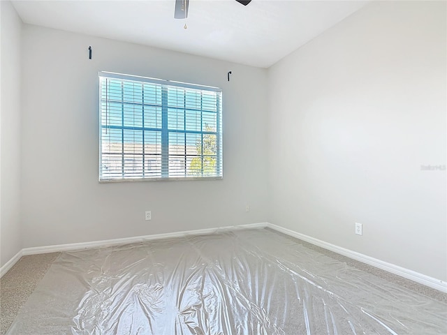 unfurnished room with ceiling fan