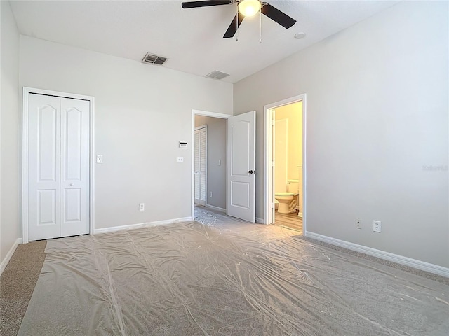 unfurnished bedroom featuring connected bathroom, ceiling fan, and a closet