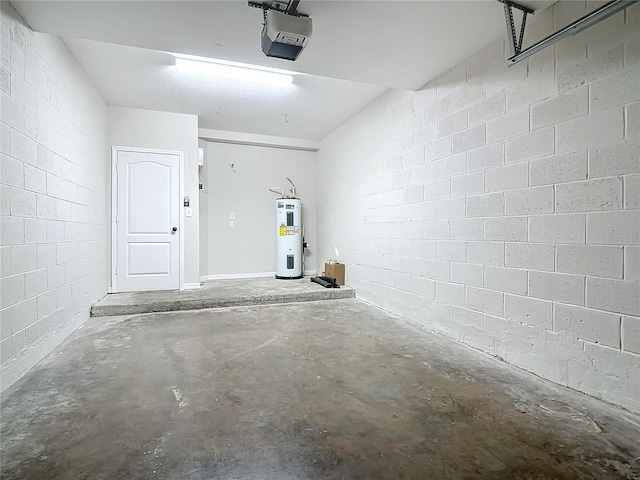 garage featuring electric water heater and a garage door opener