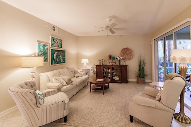 living room with ceiling fan and light tile patterned flooring