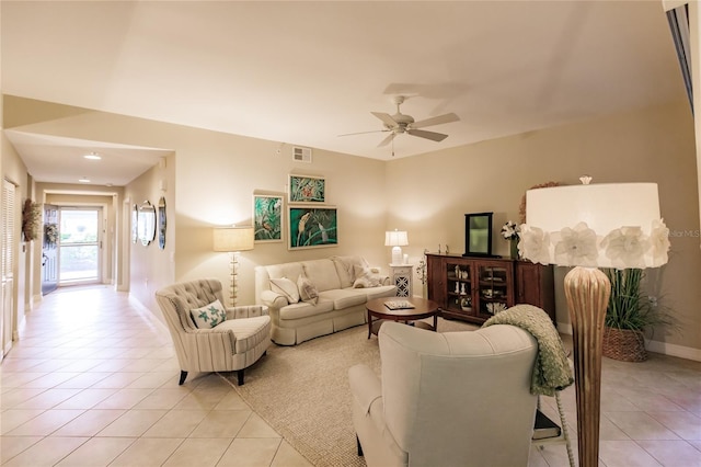 living room featuring light tile patterned floors and ceiling fan