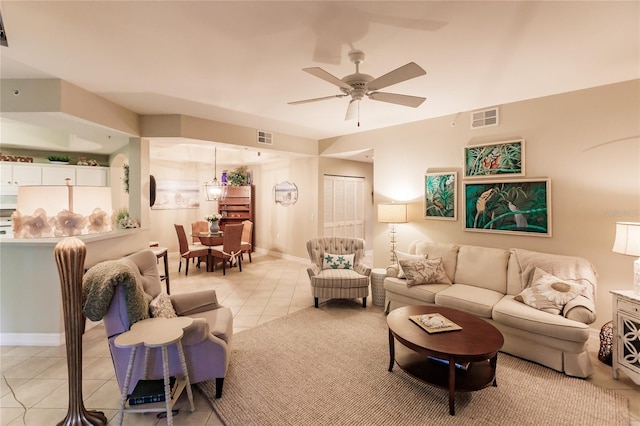 living room with light tile patterned floors and ceiling fan