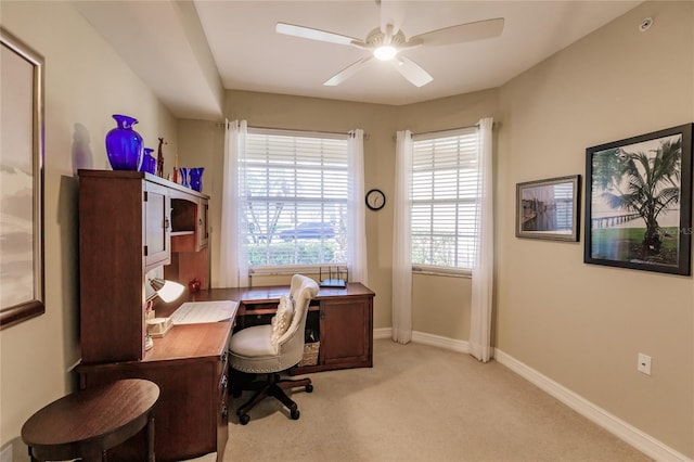 carpeted office with ceiling fan