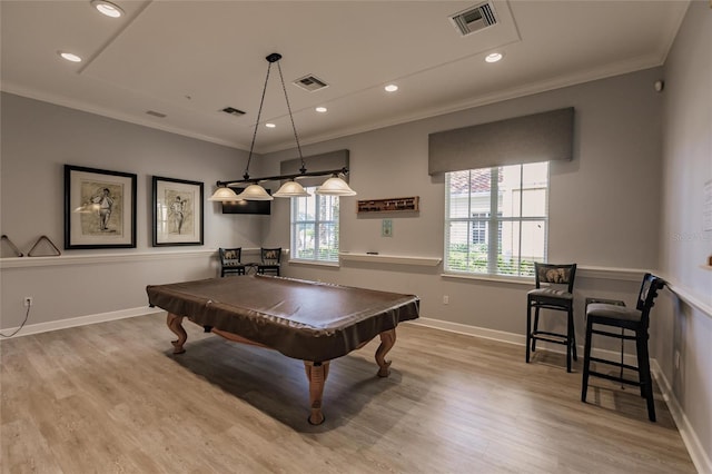 recreation room featuring ornamental molding, pool table, and light wood-type flooring