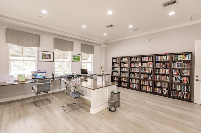 office area featuring ornamental molding and light hardwood / wood-style floors