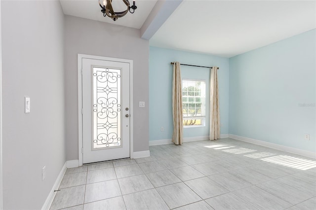 entryway with an inviting chandelier