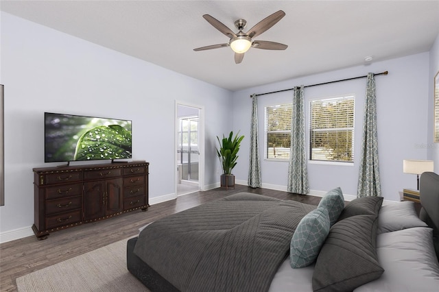 bedroom with ceiling fan, hardwood / wood-style flooring, and ensuite bath