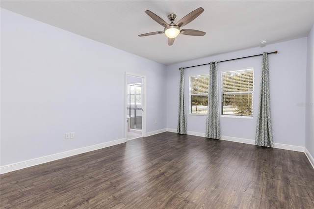 spare room featuring ceiling fan and dark hardwood / wood-style floors