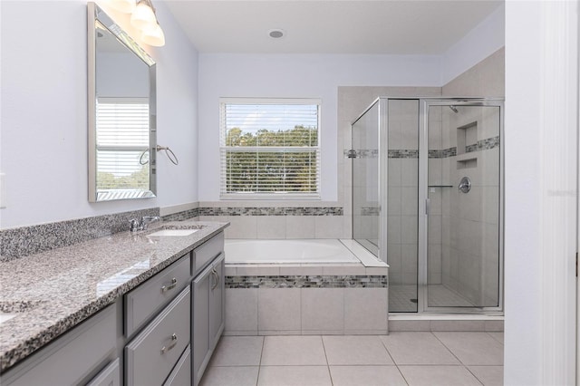 bathroom featuring vanity, separate shower and tub, and tile patterned flooring