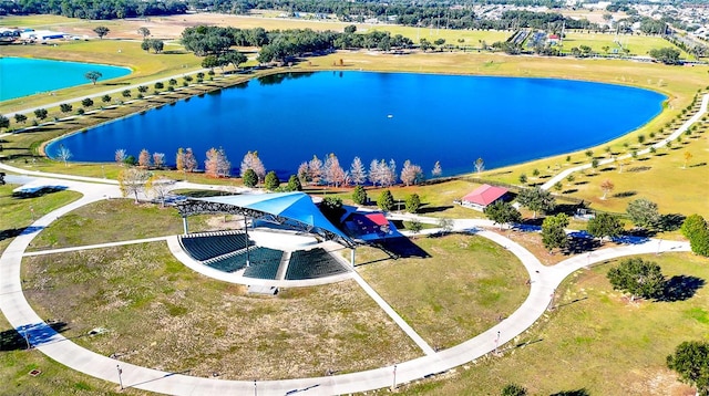 birds eye view of property featuring a water view and a rural view