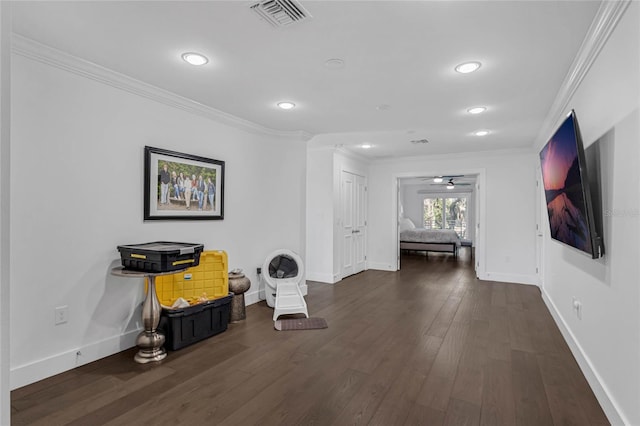 hallway featuring dark hardwood / wood-style floors and ornamental molding