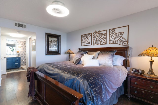 bedroom with dark wood-type flooring