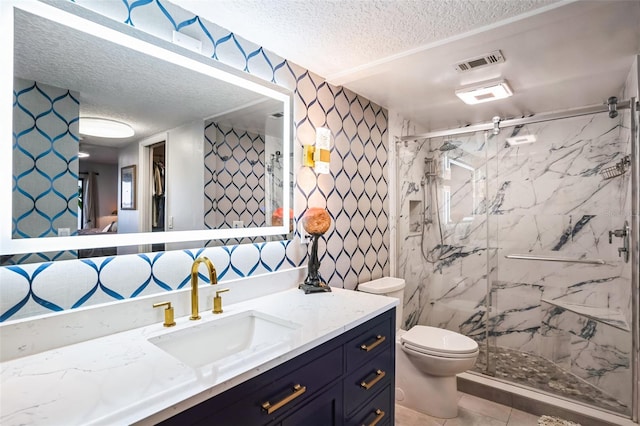 full bathroom with vanity, visible vents, a marble finish shower, a textured ceiling, and toilet