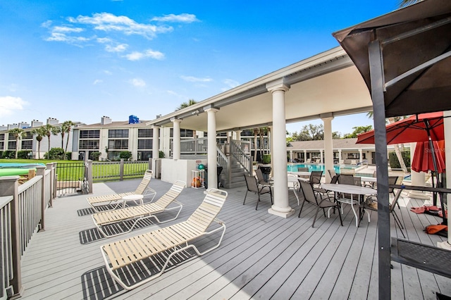 wooden deck featuring a swimming pool