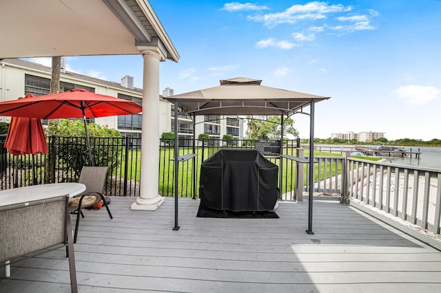 deck with a gazebo, a lawn, and a grill