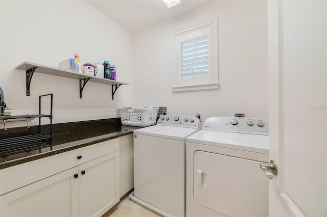 washroom with independent washer and dryer and cabinets