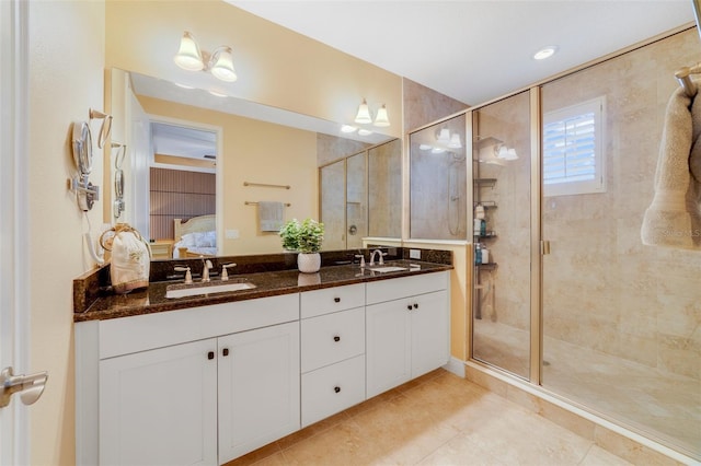 bathroom with vanity, tile patterned floors, and walk in shower