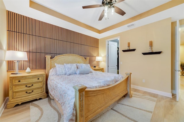 bedroom featuring light wood-type flooring and ceiling fan