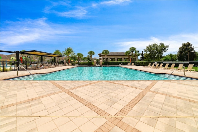 view of swimming pool featuring a patio area and a gazebo