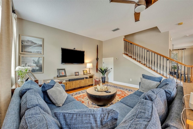 living room with ceiling fan