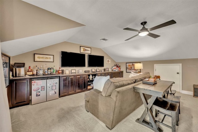 carpeted living room featuring bar, ceiling fan, and lofted ceiling