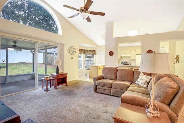 living room with light carpet, high vaulted ceiling, and ceiling fan