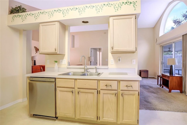 kitchen featuring light colored carpet, dishwasher, and sink