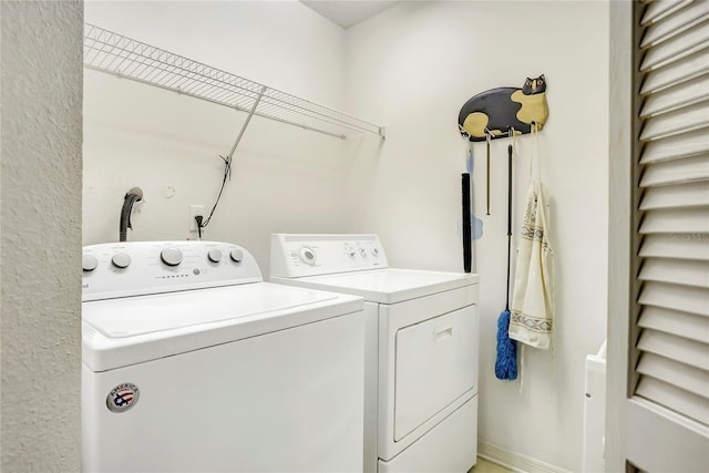 laundry room with washer and clothes dryer