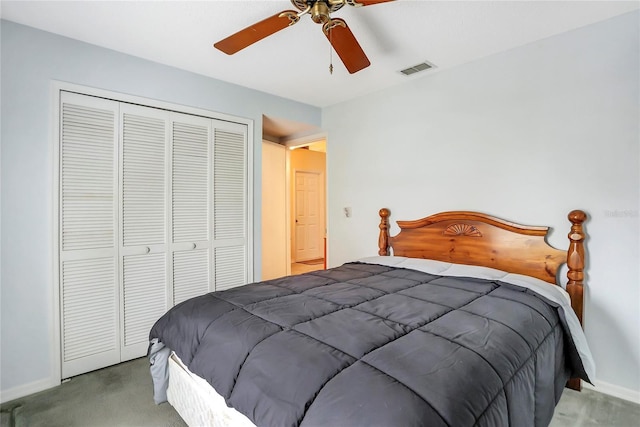 carpeted bedroom featuring a closet and ceiling fan