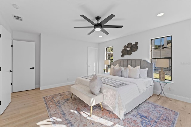 bedroom featuring ceiling fan and light hardwood / wood-style floors