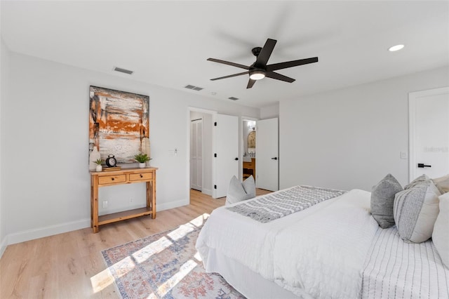 bedroom with ceiling fan and light wood-type flooring