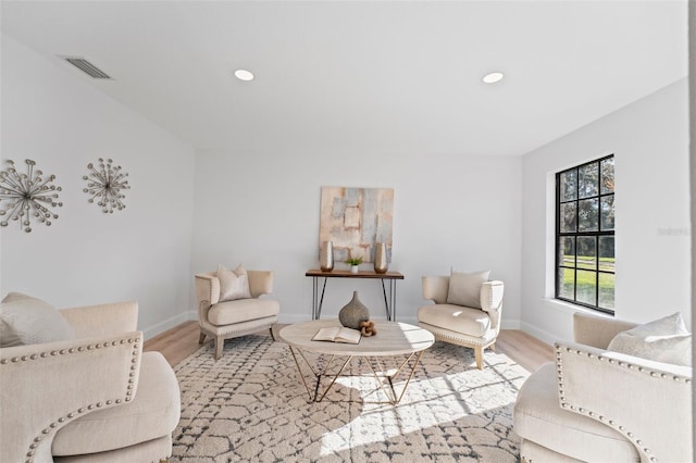 living area with light hardwood / wood-style flooring